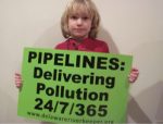 Kid with pipeline protest sign