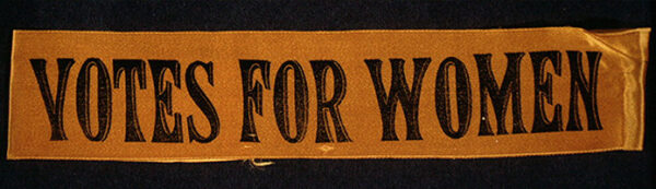 1911 ribbon from suffrage parade reading "Votes for Women"